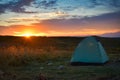 Sunrise over a tourist tent at the Lagonaki plateau Royalty Free Stock Photo